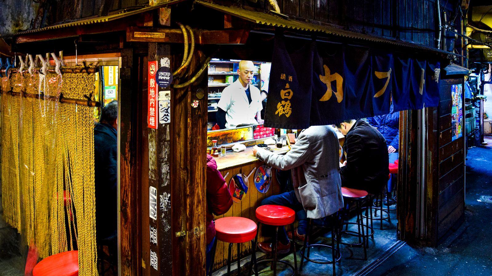 Lantern-lit izakaya alley in Shinjuku at night